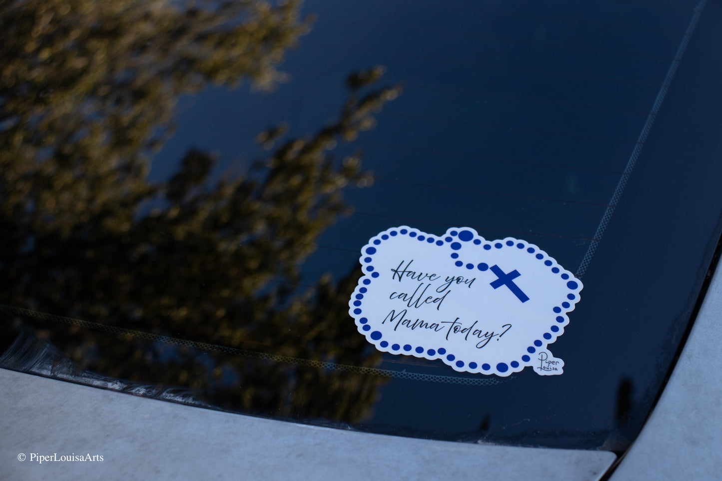 bumper sticker on car
