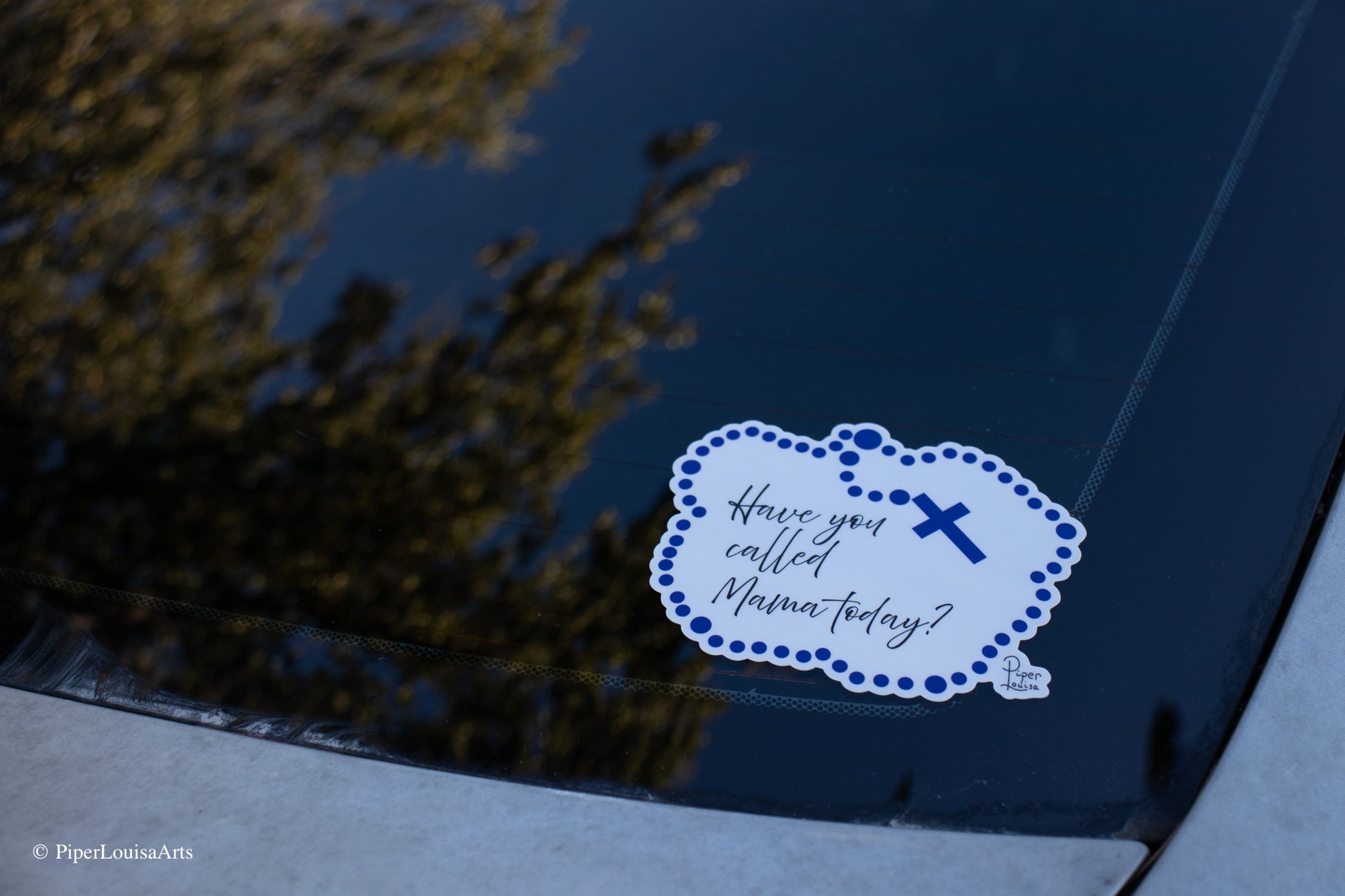 bumper sticker on car