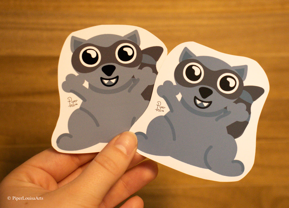 Matte on the left, Glossy on the right - Fred the Raccoon Sticker